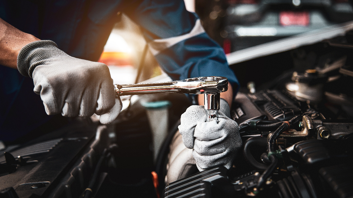 Technician performing service on an engine