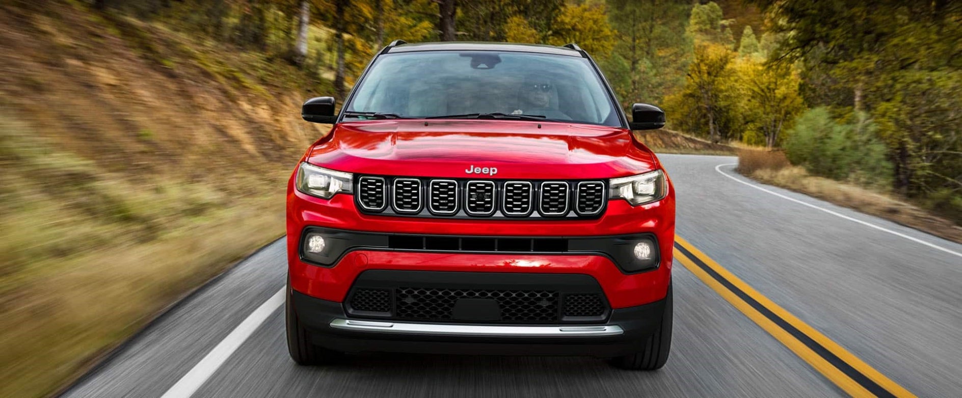 Front view of a red 2026 Jeep Compass 